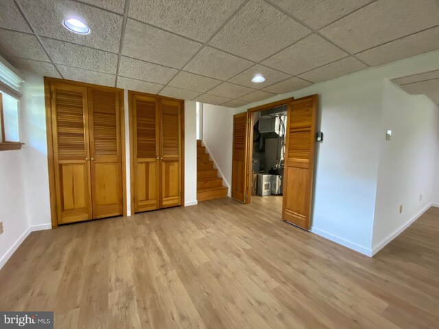 32 Waverly Rd, Cherry Hill, NJ 08003 - unfurnished bedroom featuring light wood-style flooring, recessed lighting, a paneled ceiling, and multiple closets