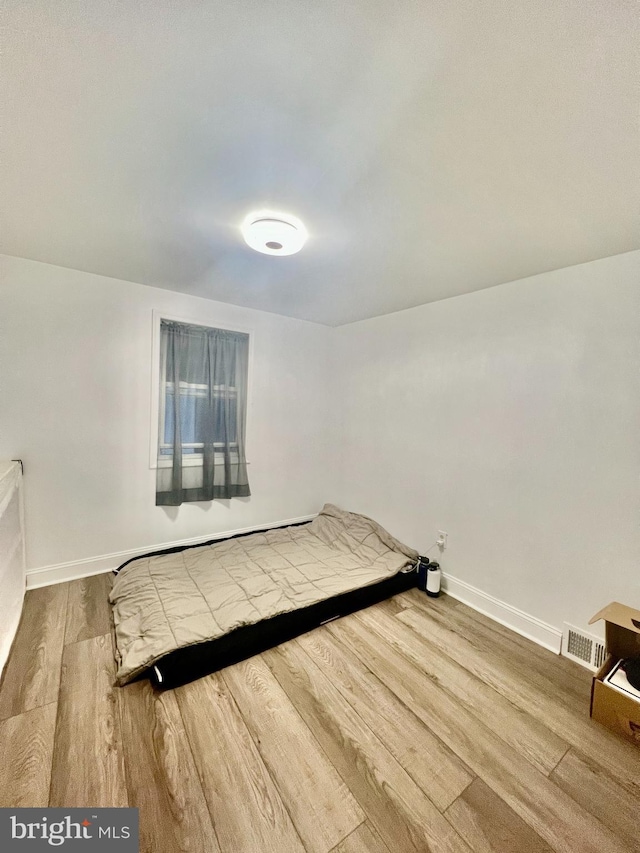 1719 S Chadwick St, Philadelphia, PA 19145 - bedroom featuring wood finished floors and baseboards