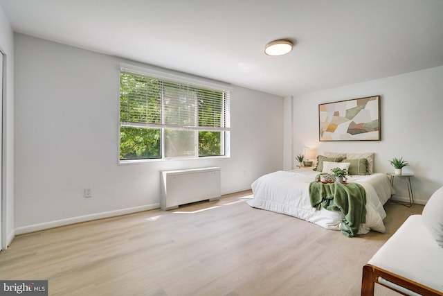 6631 Wakefield Dr Unit 209, Alexandria, VA 22307 - bedroom featuring wood finished floors, radiator, and baseboards