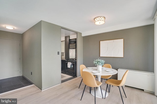 6631 Wakefield Dr Unit 209, Alexandria, VA 22307 - dining room featuring wood finished floors and baseboards