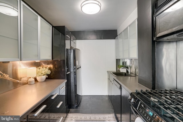 6631 Wakefield Dr Unit 209, Alexandria, VA 22307 - kitchen featuring black appliances, white cabinets, a sink, glass insert cabinets, and dark tile patterned floors