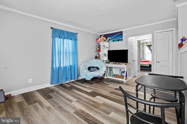 821 E Jeffrey St, Baltimore, MD 21225 - living area with ornamental molding, wood finished floors, and baseboards