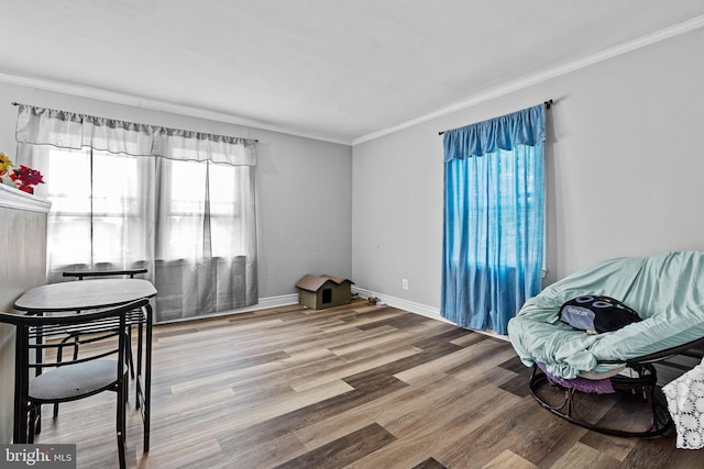 821 E Jeffrey St, Baltimore, MD 21225 - sitting room with ornamental molding, wood finished floors, and baseboards