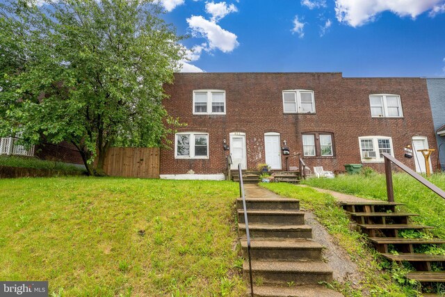 821 E Jeffrey St, Baltimore, MD 21225 - townhome / multi-family property featuring brick siding and stairway