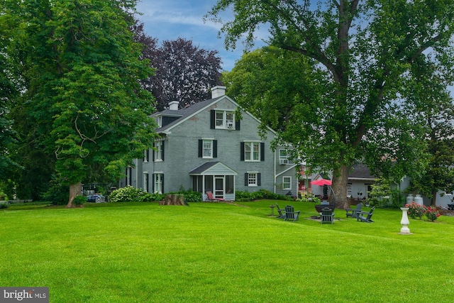 417 E Washington St, Charles Town, WV 25414 - view of front of property featuring a front lawn and a chimney
