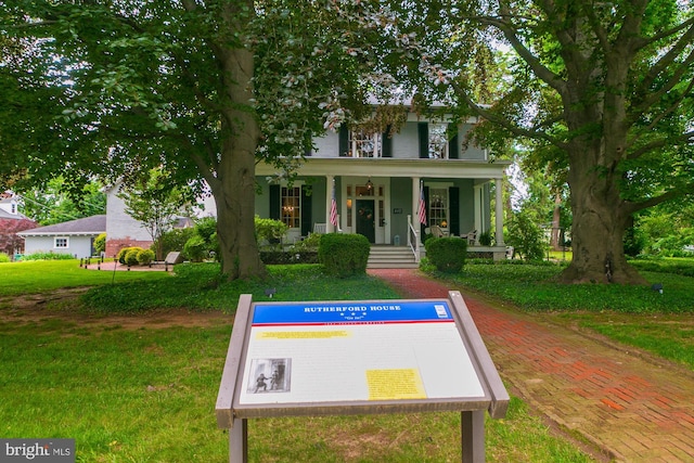 417 E Washington St, Charles Town, WV 25414 - view of front of house with a porch and a front yard
