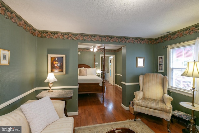 417 E Washington St, Charles Town, WV 25414 - bedroom with wood finished floors and a textured ceiling