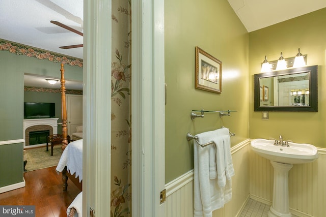 417 E Washington St, Charles Town, WV 25414 - bathroom with a ceiling fan, a fireplace, and wood finished floors