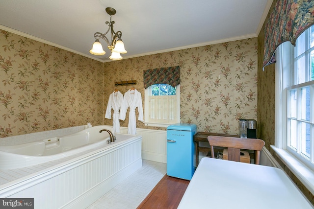 417 E Washington St, Charles Town, WV 25414 - full bath with wood finished floors, plenty of natural light, a bath, wainscoting, and ornamental molding