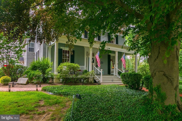 417 E Washington St, Charles Town, WV 25414 - view of property hidden behind natural elements featuring covered porch