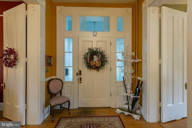 417 E Washington St, Charles Town, WV 25414 - entryway featuring plenty of natural light, wood finished floors, and a decorative wall