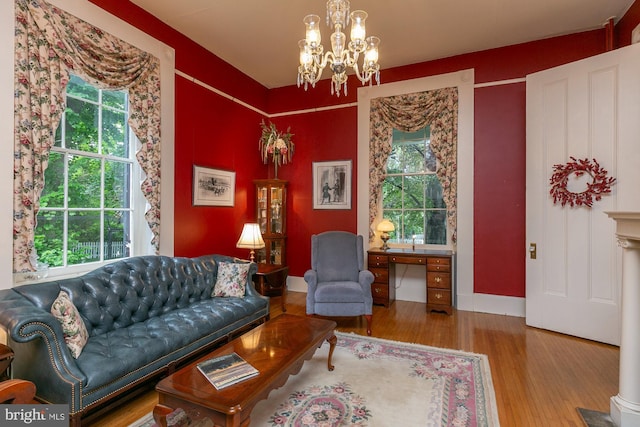417 E Washington St, Charles Town, WV 25414 - living room with wood finished floors, plenty of natural light, and a chandelier