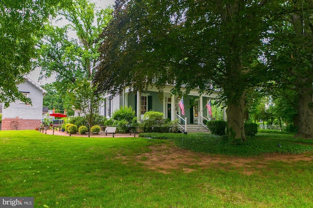 417 E Washington St, Charles Town, WV 25414 - view of front of house with a porch and a front yard