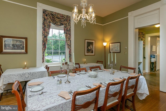 417 E Washington St, Charles Town, WV 25414 - dining area with wood finished floors and a chandelier