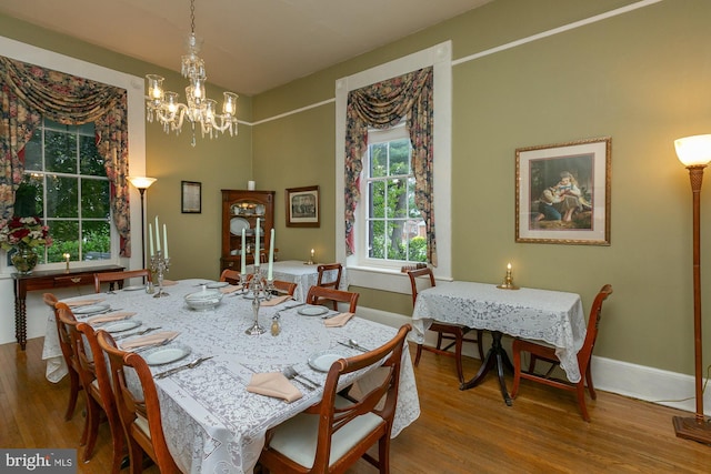 417 E Washington St, Charles Town, WV 25414 - dining room with wood finished floors and a chandelier