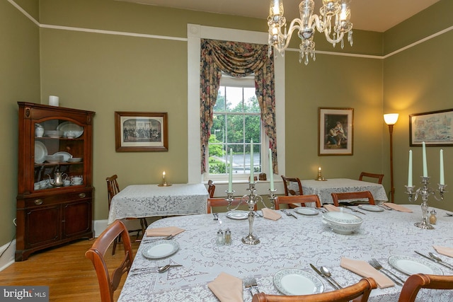 417 E Washington St, Charles Town, WV 25414 - dining space with wood finished floors and a chandelier