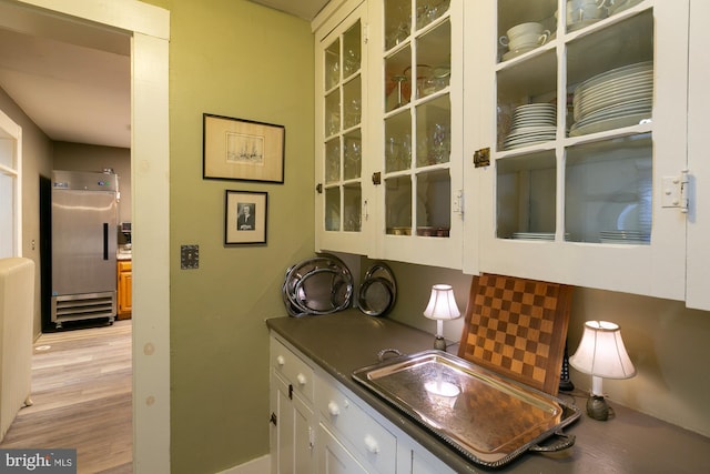 417 E Washington St, Charles Town, WV 25414 - bar with stainless steel refrigerator and light wood-style floors