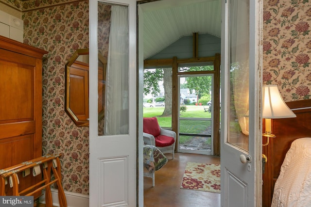 417 E Washington St, Charles Town, WV 25414 - doorway featuring wallpapered walls, concrete flooring, and vaulted ceiling
