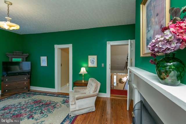 417 E Washington St, Charles Town, WV 25414 - bedroom with a textured ceiling and wood finished floors