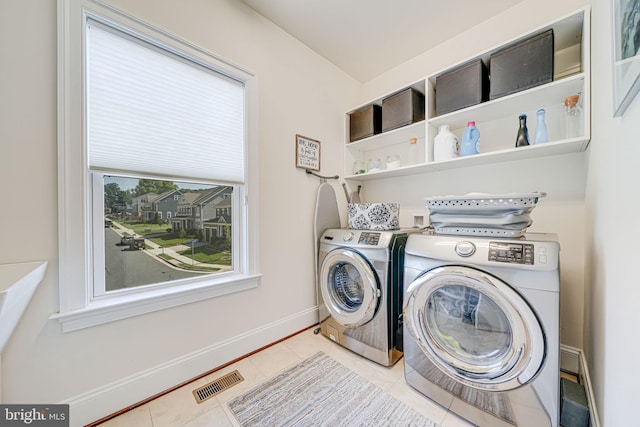 6513 Manor Ridge Ct, Falls Church, VA 22043 - laundry area featuring independent washer and dryer, light tile patterned floors, and baseboards
