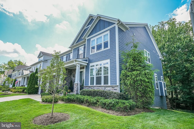 6513 Manor Ridge Ct, Falls Church, VA 22043 - craftsman house with stone siding, a front lawn, board and batten siding, and driveway