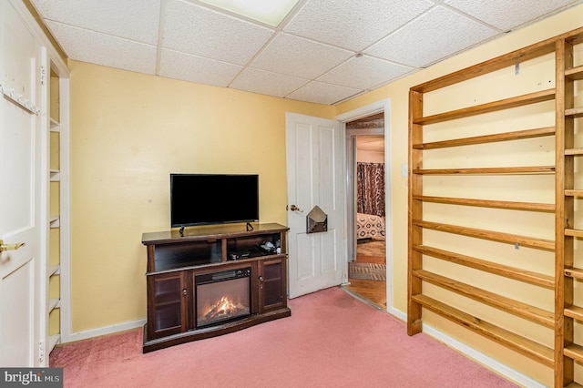 1132 State Rd, Duncannon, PA 17020 - living area featuring a paneled ceiling, carpet, baseboards, and a glass covered fireplace