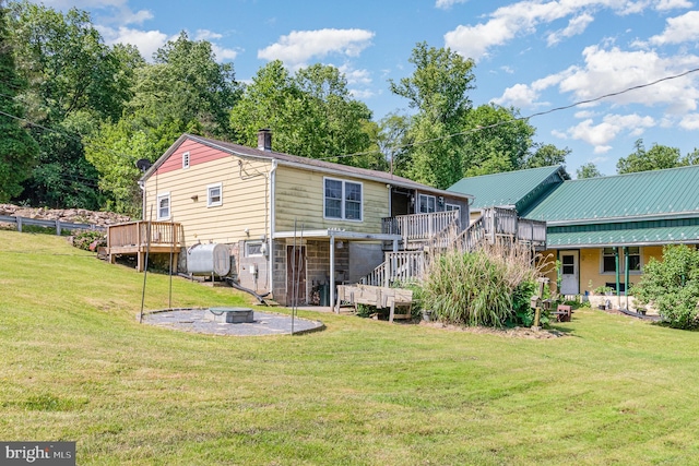 1132 State Rd, Duncannon, PA 17020 - back of house with an outdoor fire pit, oil tank, stairs, a deck, and a yard