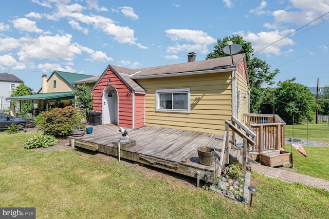 1132 State Rd, Duncannon, PA 17020 - back of property with a lawn, a deck, a chimney, and central air condition unit