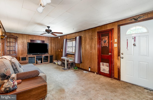 1132 State Rd, Duncannon, PA 17020 - carpeted living area with wooden walls and a ceiling fan