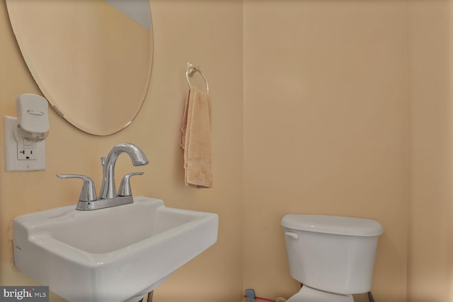4613 Dillon St, Baltimore, MD 21224 - half bathroom with a sink and toilet
