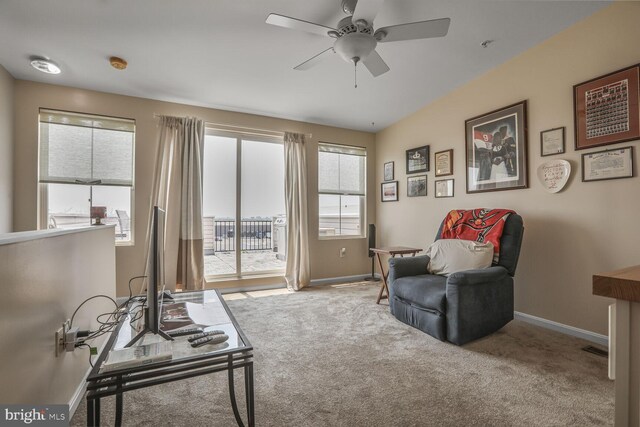 4613 Dillon St, Baltimore, MD 21224 - living area with a ceiling fan and carpet