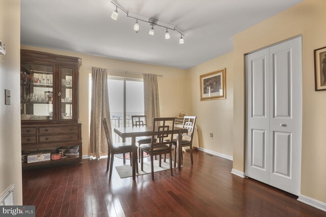 4613 Dillon St, Baltimore, MD 21224 - dining area with dark wood-style floors and baseboards