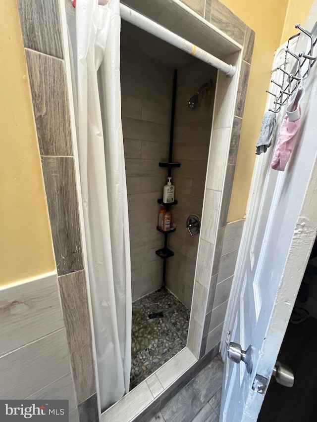 5131 Ludlow St, Philadelphia, PA 19139 - full bath featuring a tile shower and a wainscoted wall