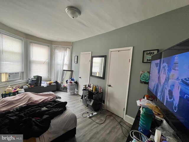 5131 Ludlow St, Philadelphia, PA 19139 - bedroom with wood finished floors, baseboards, and cooling unit