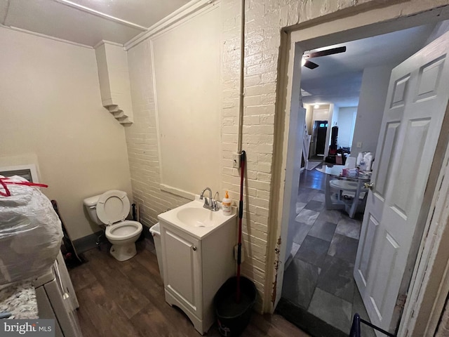 5131 Ludlow St, Philadelphia, PA 19139 - bathroom featuring vanity, toilet, and wood finished floors