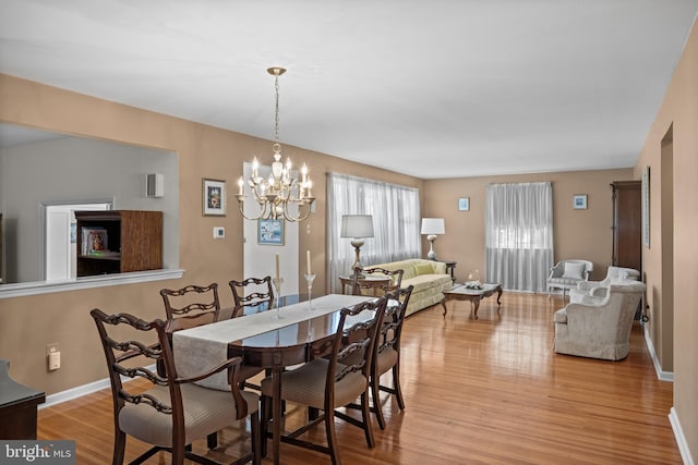 419 Saratoga Dr, Cherry Hill, NJ 08002 - dining area with light wood-style floors and a chandelier