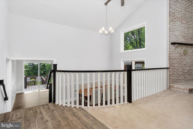 11239 Putman Rd, Thurmont, MD 21788 - corridor with plenty of natural light, wood finished floors, a chandelier, and high vaulted ceiling