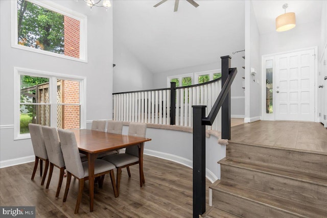 11239 Putman Rd, Thurmont, MD 21788 - dining room with high vaulted ceiling, wood finished floors, stairs, and baseboards
