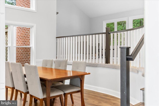 11239 Putman Rd, Thurmont, MD 21788 - dining space featuring wood finished floors, vaulted ceiling, and baseboards