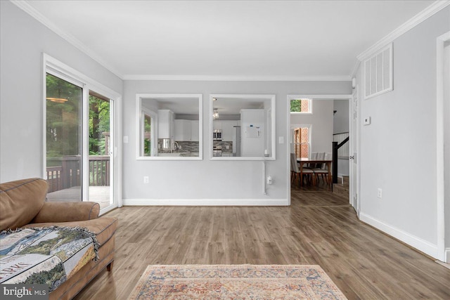 11239 Putman Rd, Thurmont, MD 21788 - living room with ornamental molding, wood finished floors, and baseboards