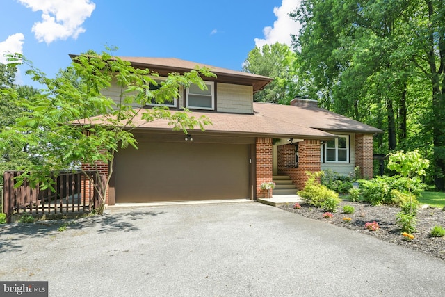 11239 Putman Rd, Thurmont, MD 21788 - view of front of home featuring asphalt driveway, brick siding, a garage, and a shingled roof