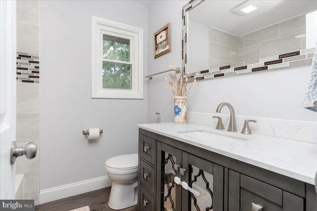 11239 Putman Rd, Thurmont, MD 21788 - bathroom featuring vanity, wood finished floors, toilet, and baseboards