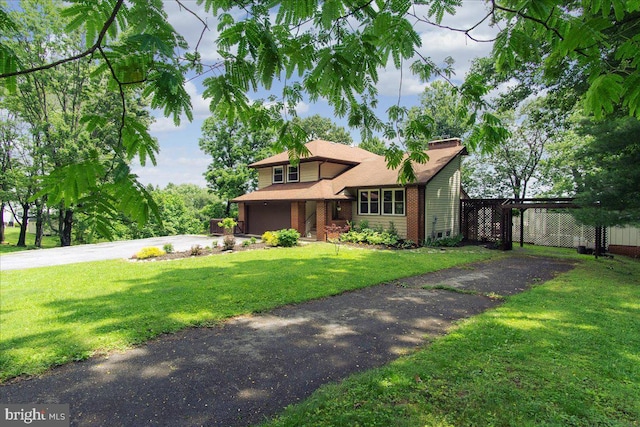 11239 Putman Rd, Thurmont, MD 21788 - view of front of property featuring driveway, an attached garage, a front lawn, and brick siding