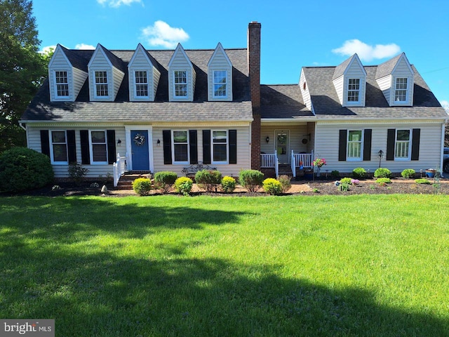 11 Thomas Cir, New Freedom, PA 17349 - cape cod home with a chimney, a front yard, and roof with shingles
