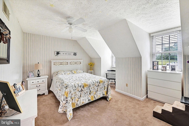 11 Thomas Cir, New Freedom, PA 17349 - bedroom featuring light colored carpet, a textured ceiling, lofted ceiling, a ceiling fan, and wallpapered walls