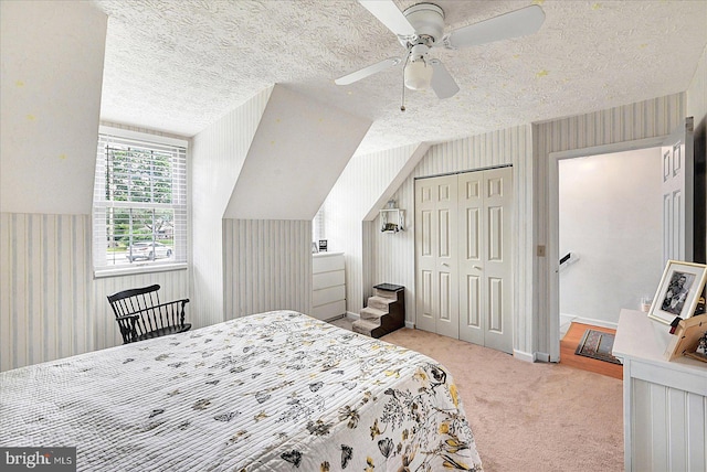 11 Thomas Cir, New Freedom, PA 17349 - bedroom featuring wallpapered walls, carpet floors, a textured ceiling, a closet, and a ceiling fan