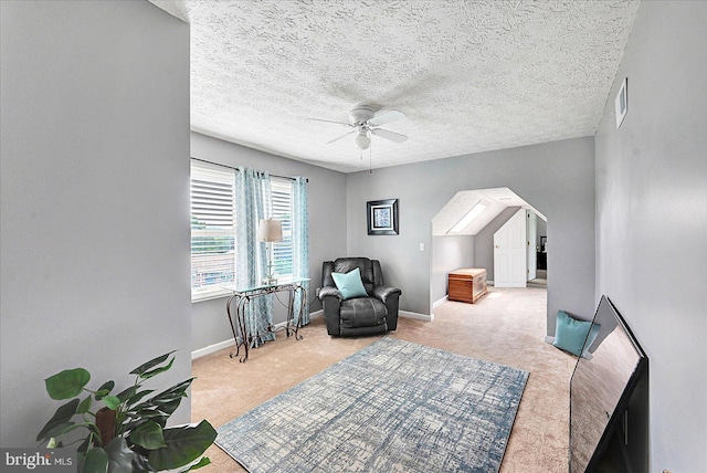 11 Thomas Cir, New Freedom, PA 17349 - living area featuring carpet, a ceiling fan, arched walkways, and a textured ceiling