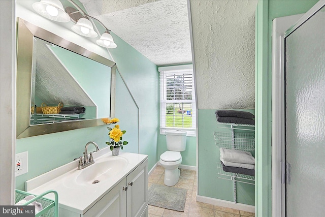 11 Thomas Cir, New Freedom, PA 17349 - full bath featuring vanity, a textured ceiling, an enclosed shower, and tile patterned flooring