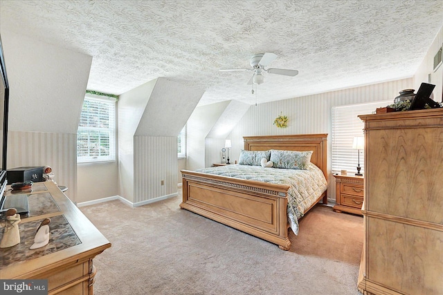 11 Thomas Cir, New Freedom, PA 17349 - bedroom featuring light colored carpet, a textured ceiling, ceiling fan, and vaulted ceiling