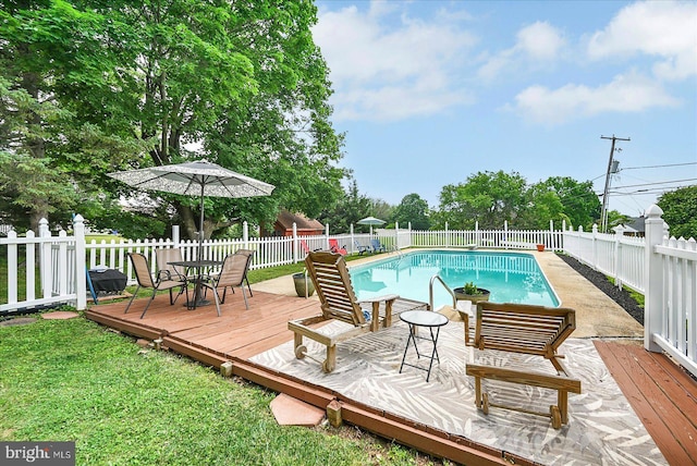 11 Thomas Cir, New Freedom, PA 17349 - view of swimming pool with a fenced backyard, a deck, and outdoor dining space